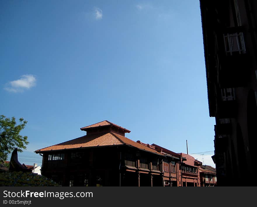 A built Structure with strong red color, shoot at very low angle view. sky background. A built Structure with strong red color, shoot at very low angle view. sky background.