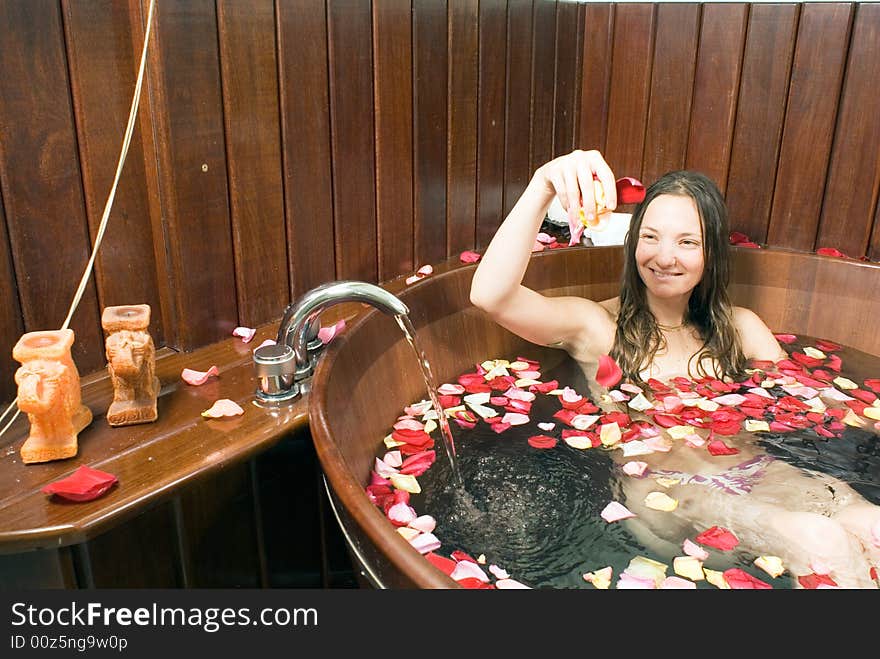 Young Lady Relaxing in Bathtub - horizontal