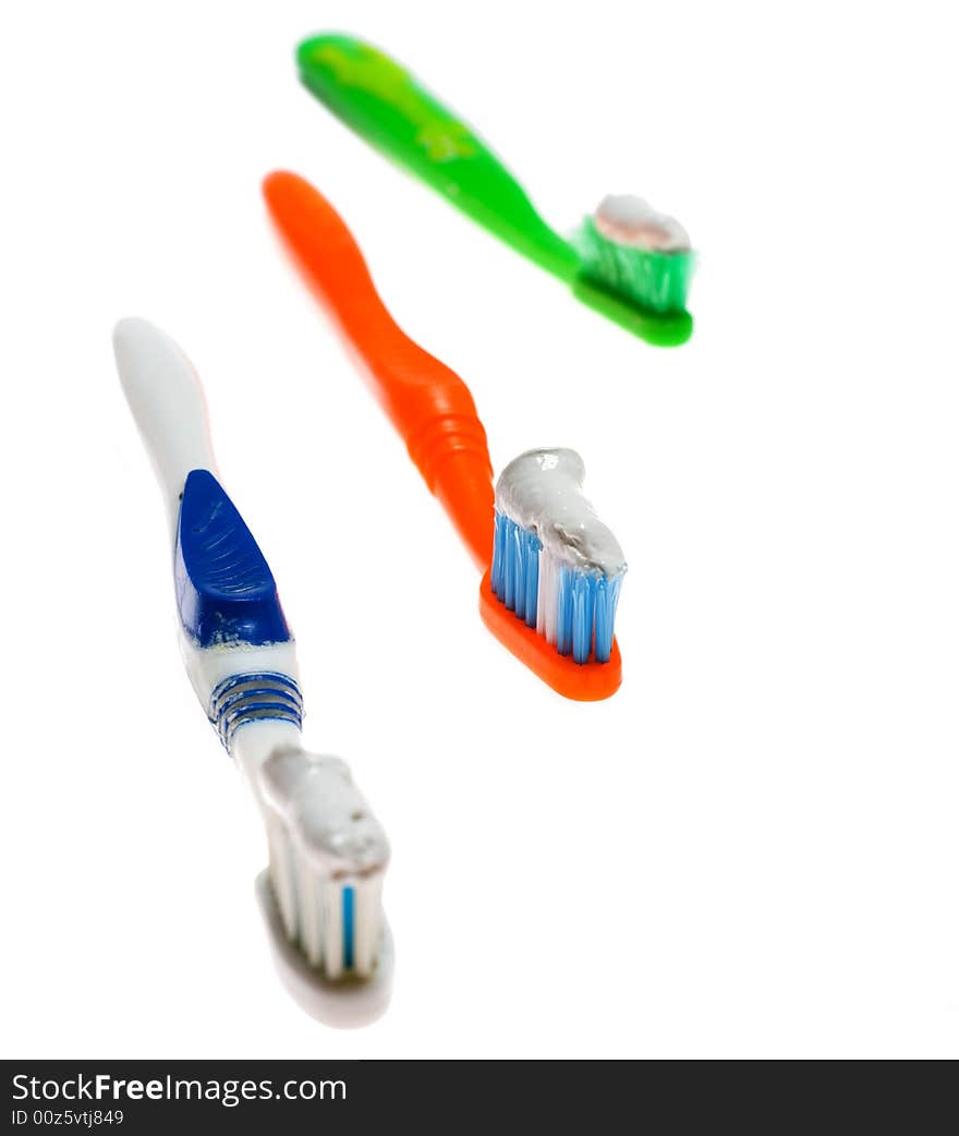 Three toothbrush with toothpase on its isolated on white backgrounds. Three toothbrush with toothpase on its isolated on white backgrounds