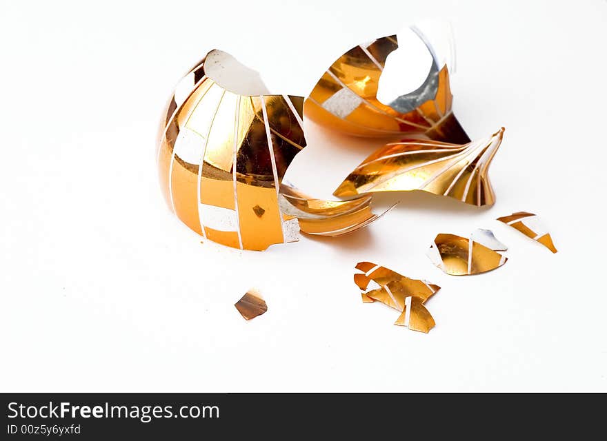 Broken glass christmas ball isolated on white background