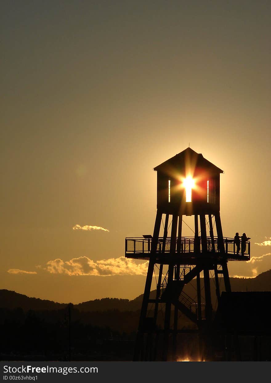 Observation tower in silhouette at sunset in Magog, province of Quebec, Canada. Observation tower in silhouette at sunset in Magog, province of Quebec, Canada