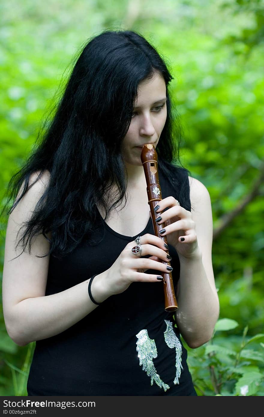 Gotic woman with an old flute