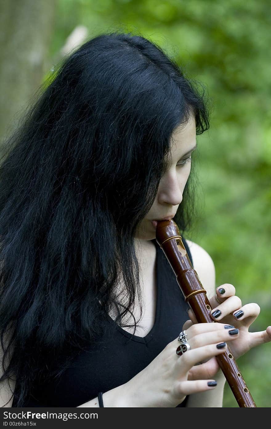 Gotic woman with an old flute