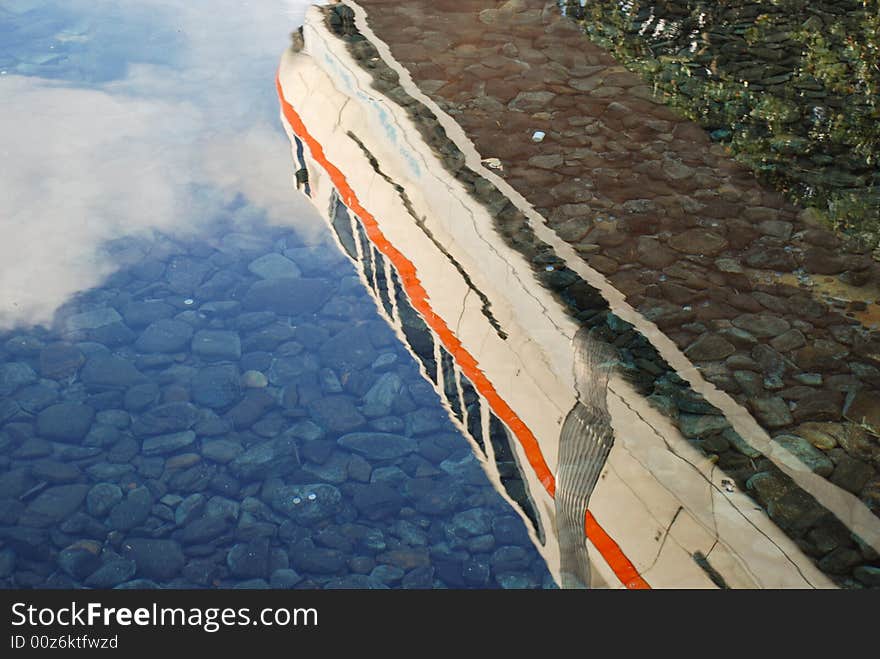 A monorail reflected in clear water. A monorail reflected in clear water