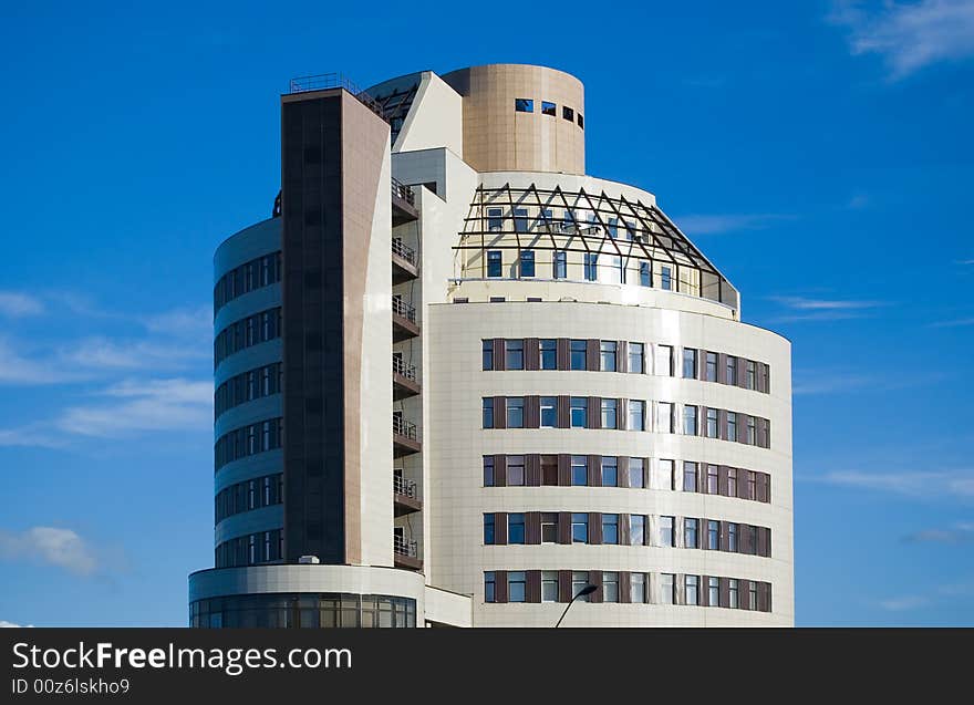 Modern office building. Blue sky background