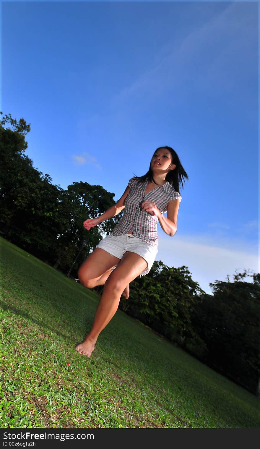 Picture of a Happy Girl out in the park. Indicative of mood, joyous occasion, promotion of healthy living and lifestyle. Picture of a Happy Girl out in the park. Indicative of mood, joyous occasion, promotion of healthy living and lifestyle.