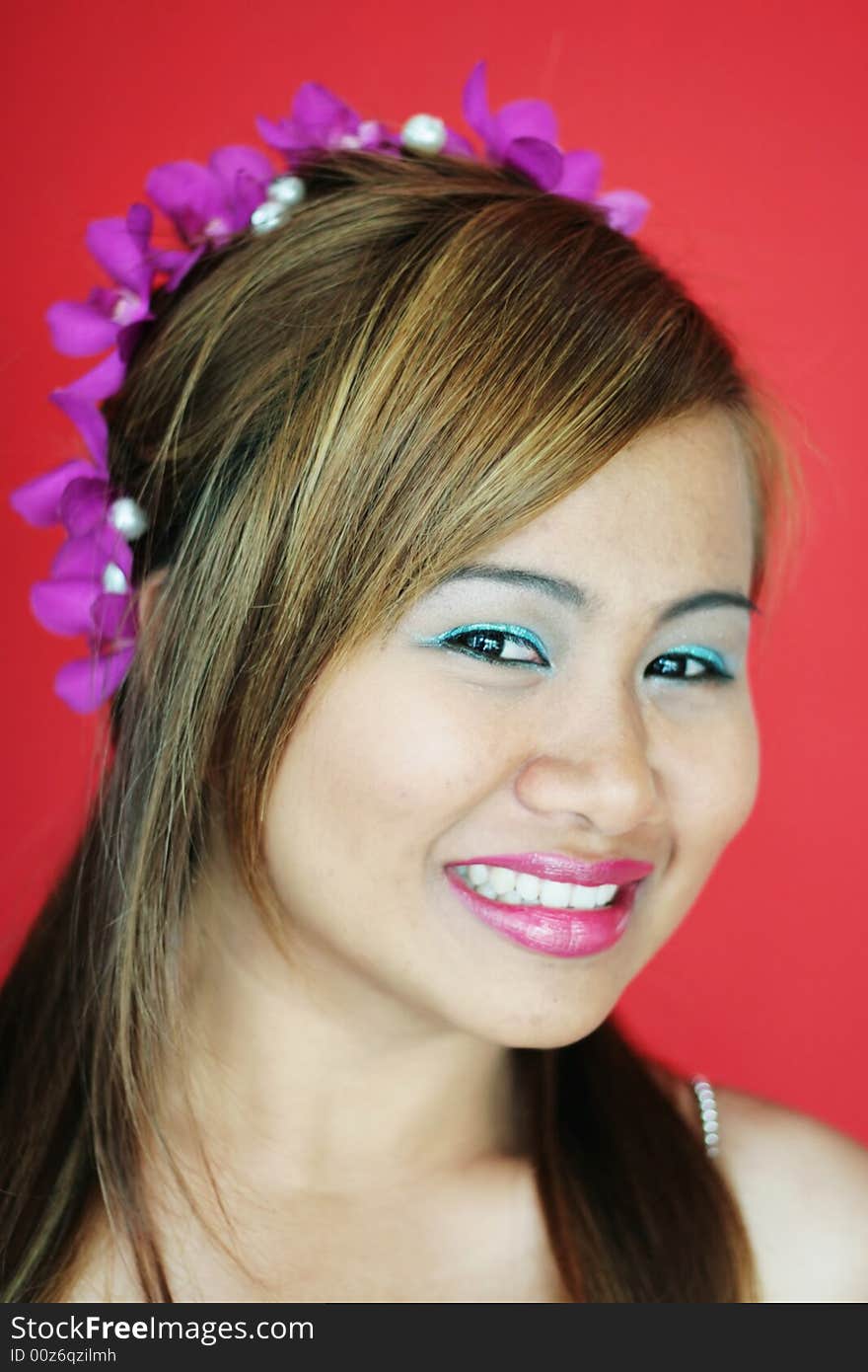 Gorgeous Thai woman with flowers in her hair - bride or bridesmaid image. Gorgeous Thai woman with flowers in her hair - bride or bridesmaid image.