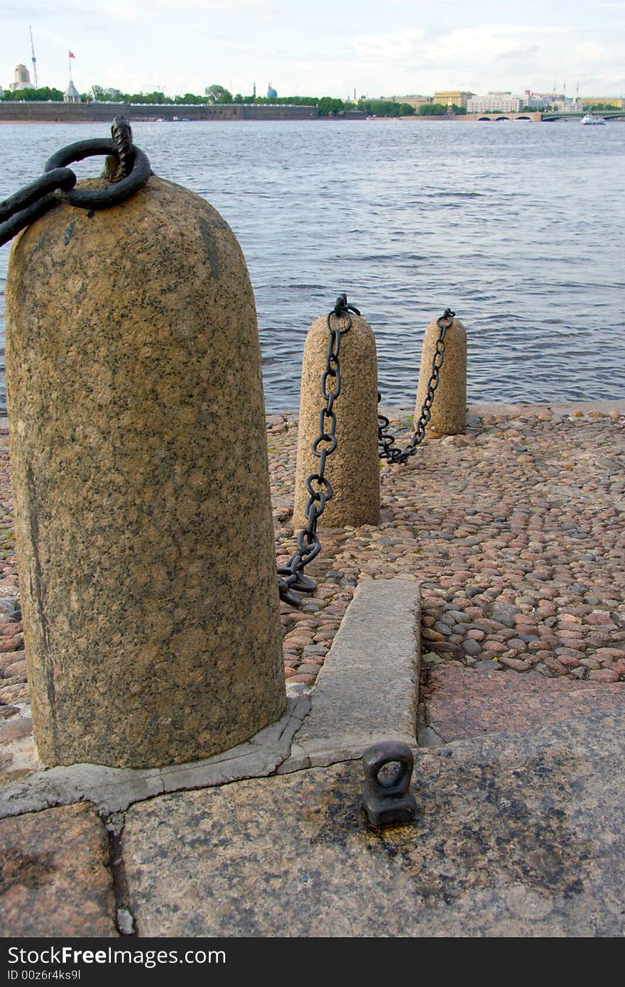 Granite river embankment with wharf chain in Saint-Petersburg