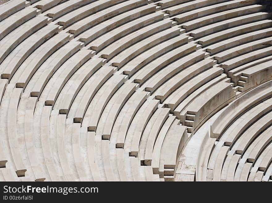 Outdoor stone amphitheater in the sunlight. Stairs.