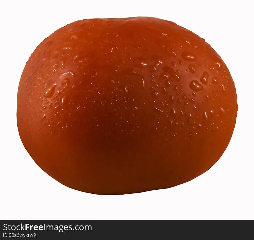 Ripe tomato with drops of water on a skin