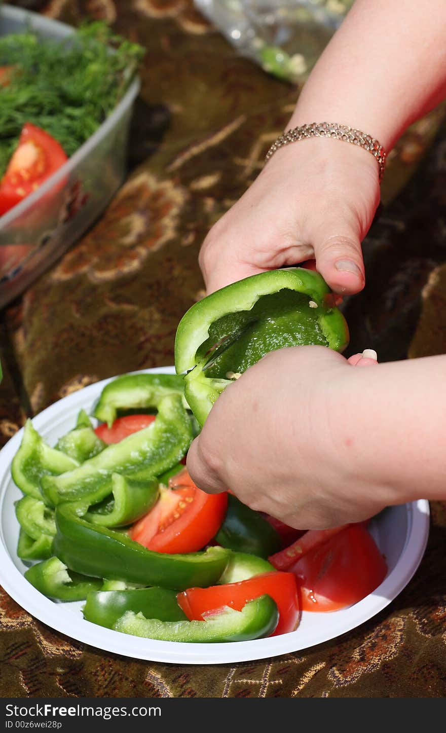 Hands Of The Girl Cut Sweet Pepper