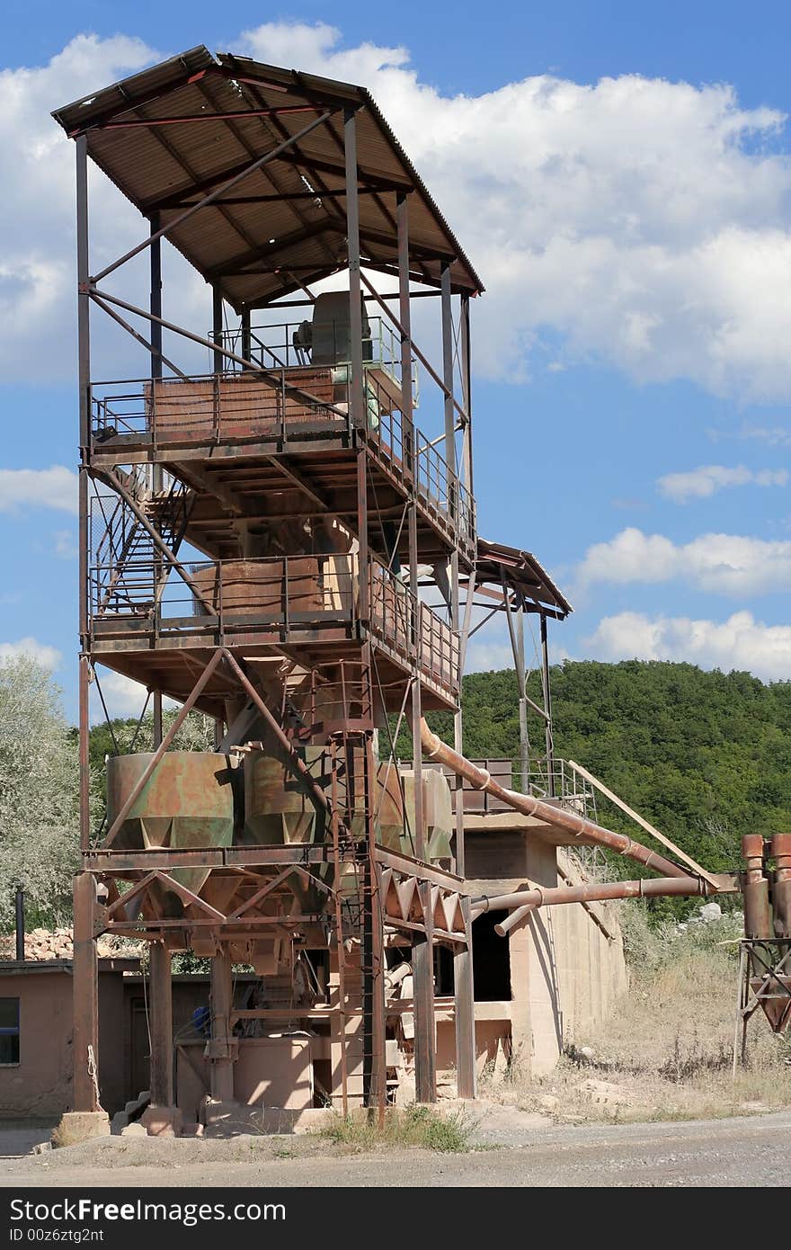 Very Old Stone Crusher under cloudy sky. Very Old Stone Crusher under cloudy sky