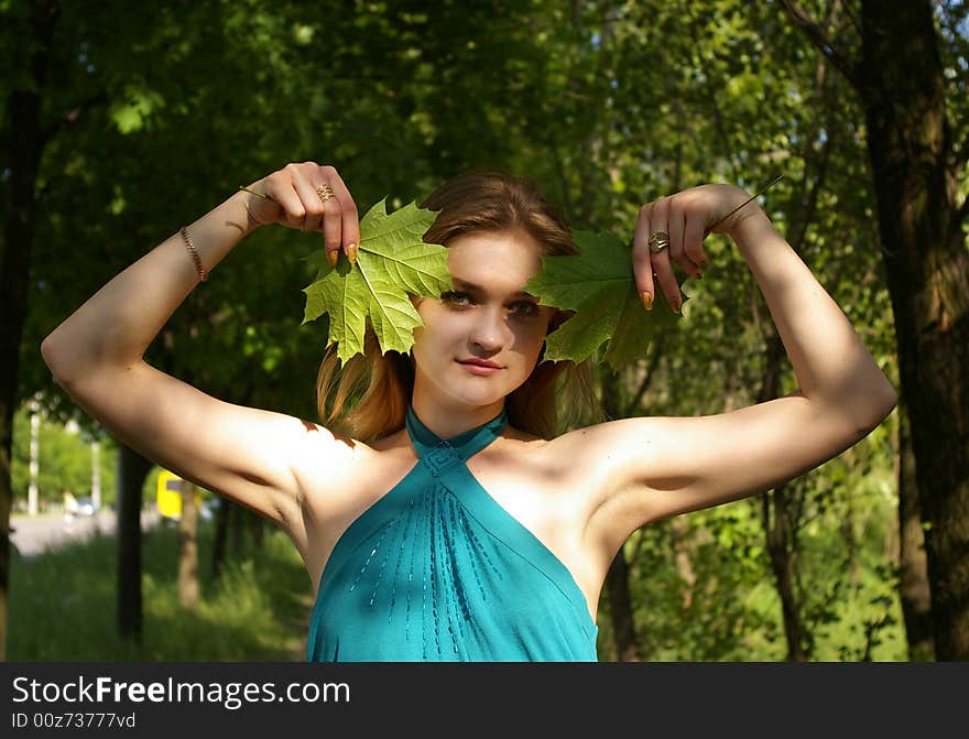 Woman Holds Maple Leaves