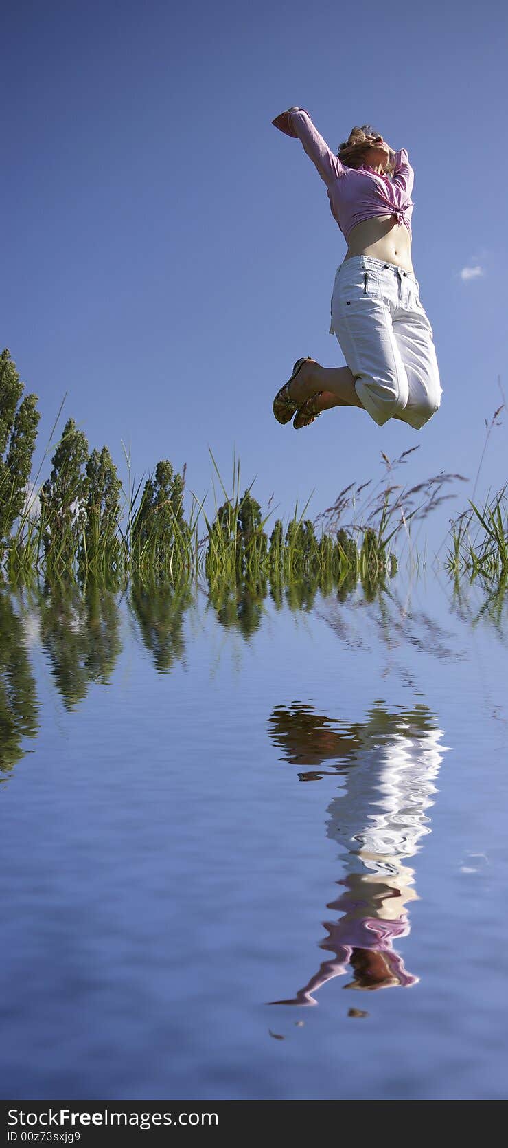 Woman jumping on the beach