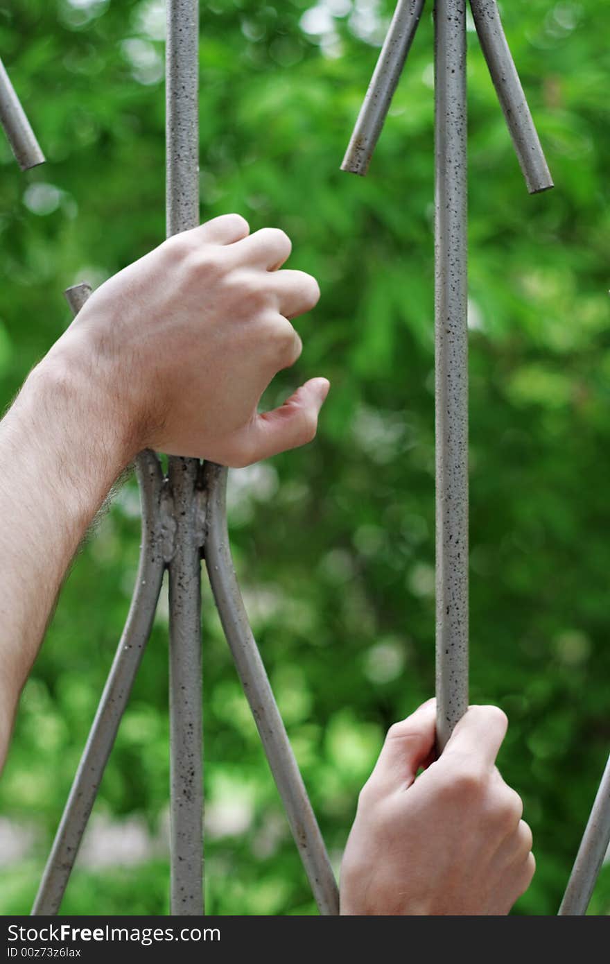 Hands on bar with hope (focus on hand). Hands on bar with hope (focus on hand).