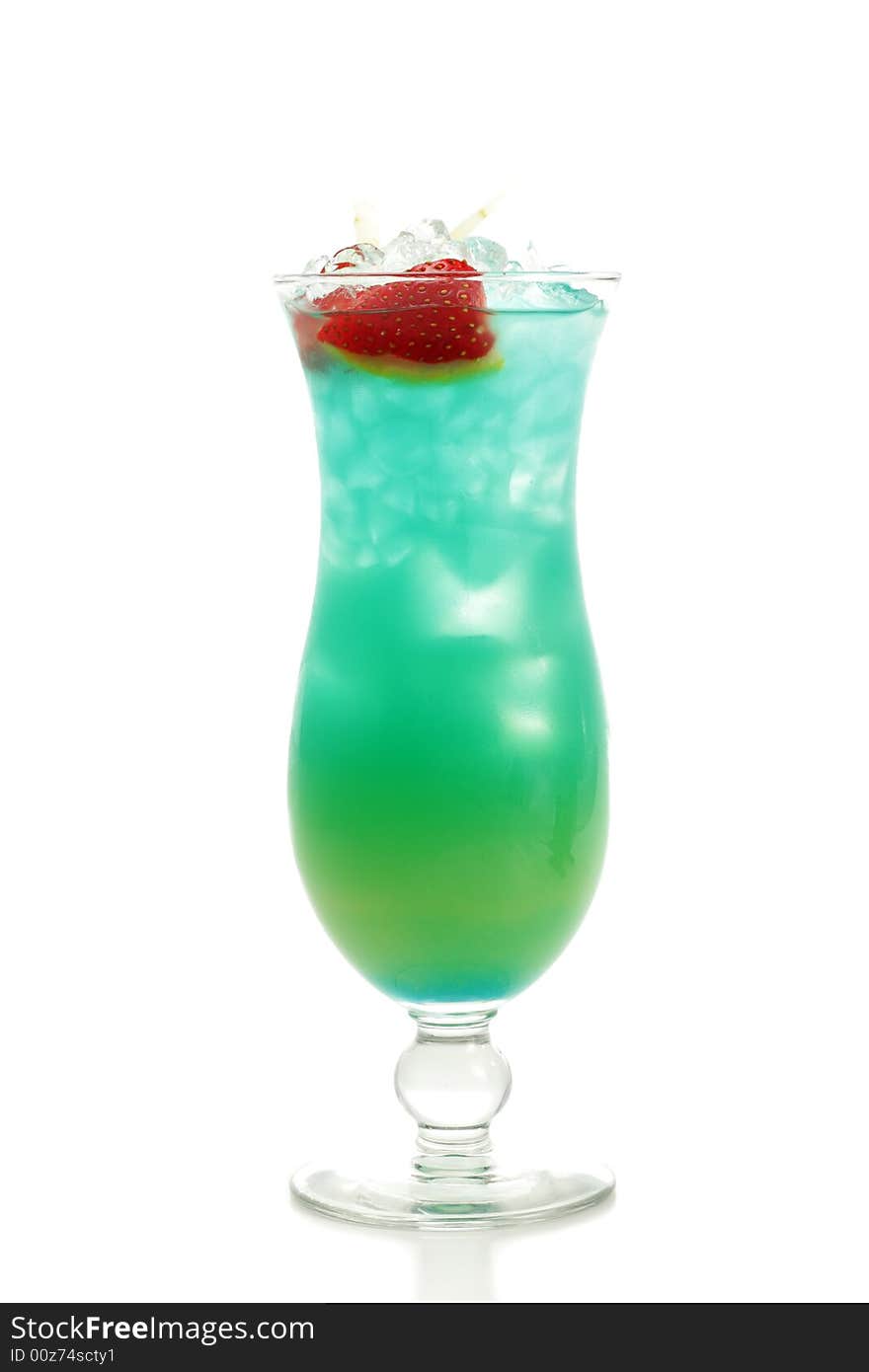 Tropical Acoholic Drink Made of Rum, Pineapple Juice, Blue Curacao, Sweet and Sour Mix. Slice of Apple and Strawberry as a Garnish. Tropical Acoholic Drink Made of Rum, Pineapple Juice, Blue Curacao, Sweet and Sour Mix. Slice of Apple and Strawberry as a Garnish.