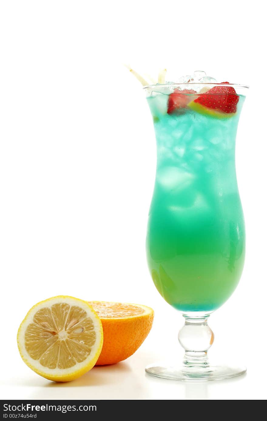 Tropical Acoholic Drink Made of Rum, Pineapple Juice, Blue Curacao, Sweet and Sour Mix. Slice of Apple and Strawberry as a Garnish. Tropical Acoholic Drink Made of Rum, Pineapple Juice, Blue Curacao, Sweet and Sour Mix. Slice of Apple and Strawberry as a Garnish.