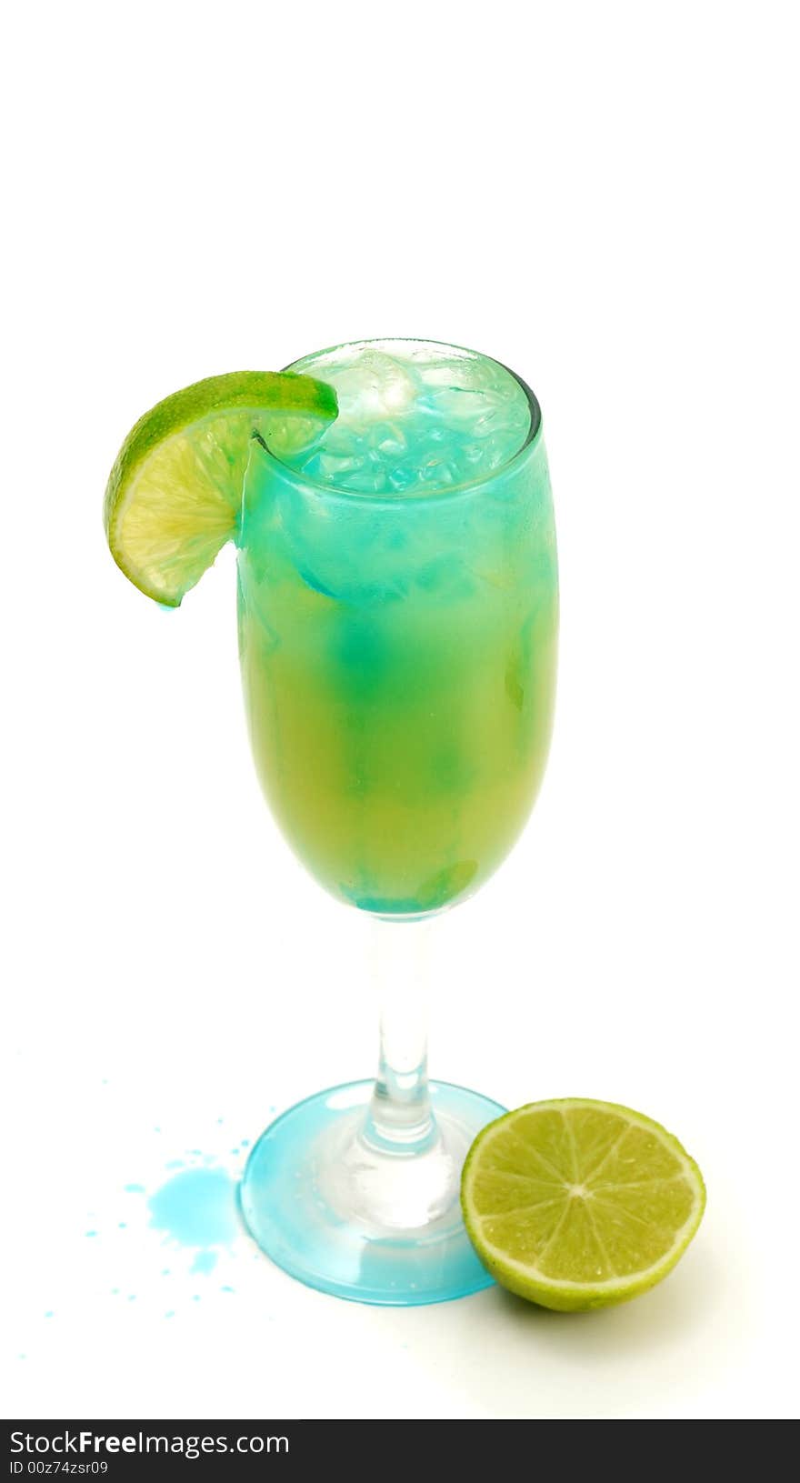 Refreshment Acoholic Drink with Martini, Blue Curacao, and Pineapple Juice. Lime Garnish. Isolated on White Background. Refreshment Acoholic Drink with Martini, Blue Curacao, and Pineapple Juice. Lime Garnish. Isolated on White Background.