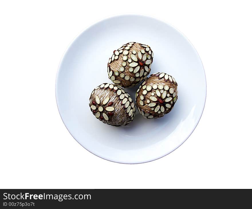 Three handmade Easter eggs at the plate