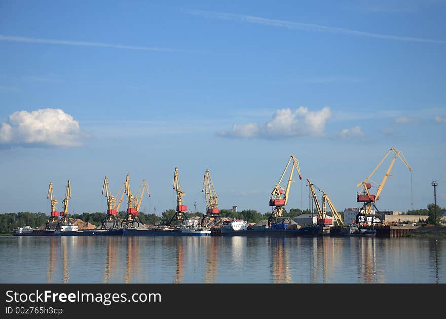 Panorama of cranes against the blue evening sky. Panorama of cranes against the blue evening sky