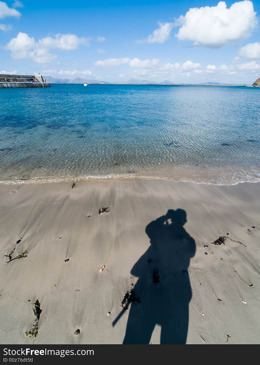 Shadow of a photographer on the beach