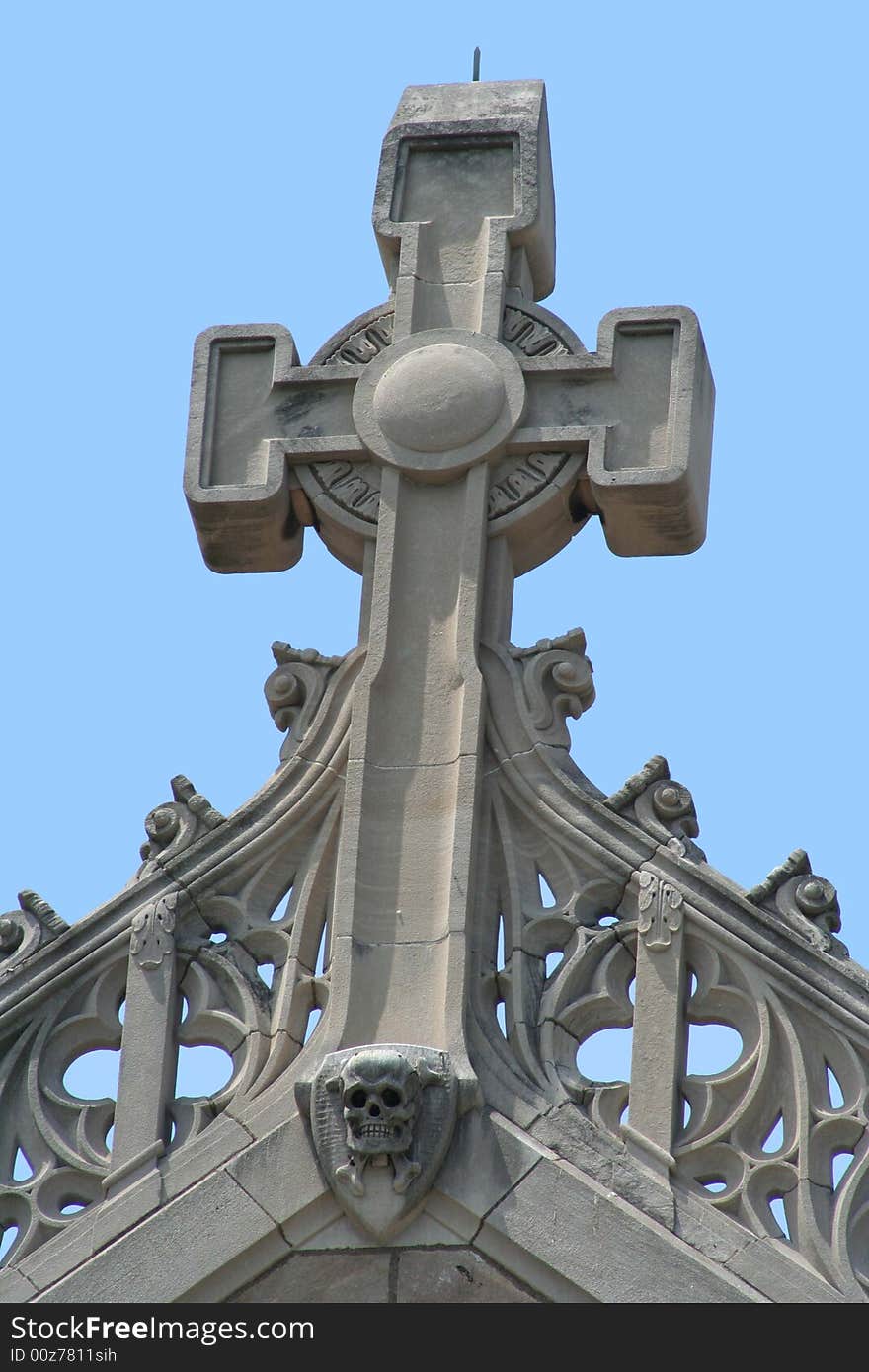 Cross on top of an old church with a bright blue sky background. Cross on top of an old church with a bright blue sky background