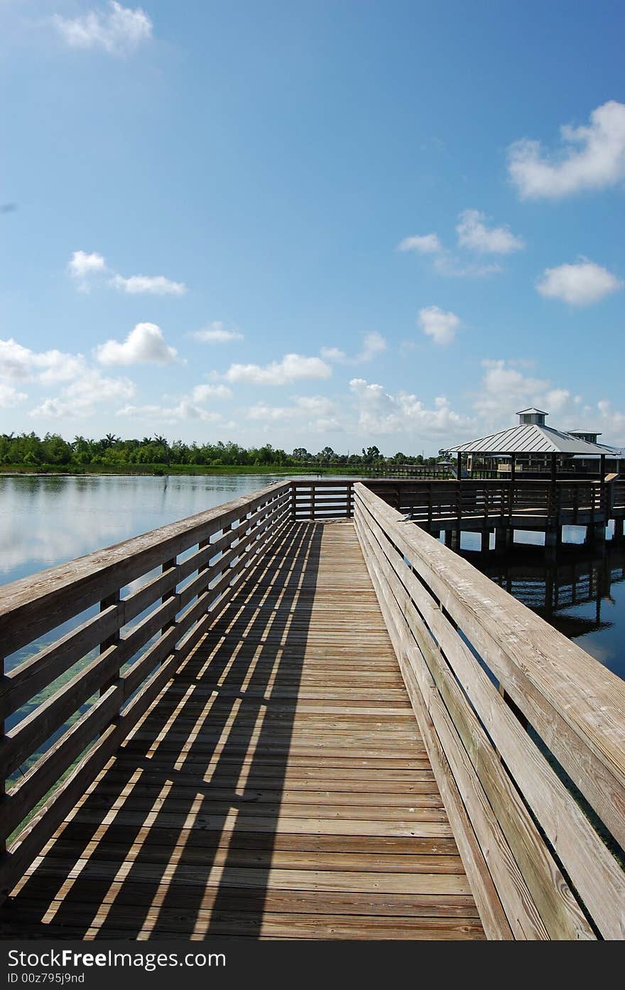 Wooden walkway leading out over water