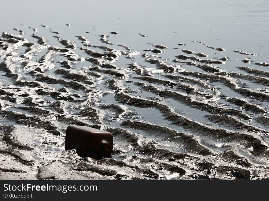 Empty bottle on sea coast. Empty bottle on sea coast.