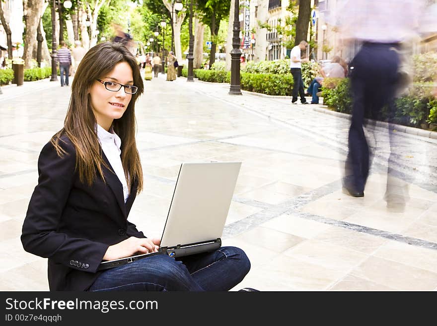 Young businesswoman in blue jeans portrait in urban background. Young businesswoman in blue jeans portrait in urban background