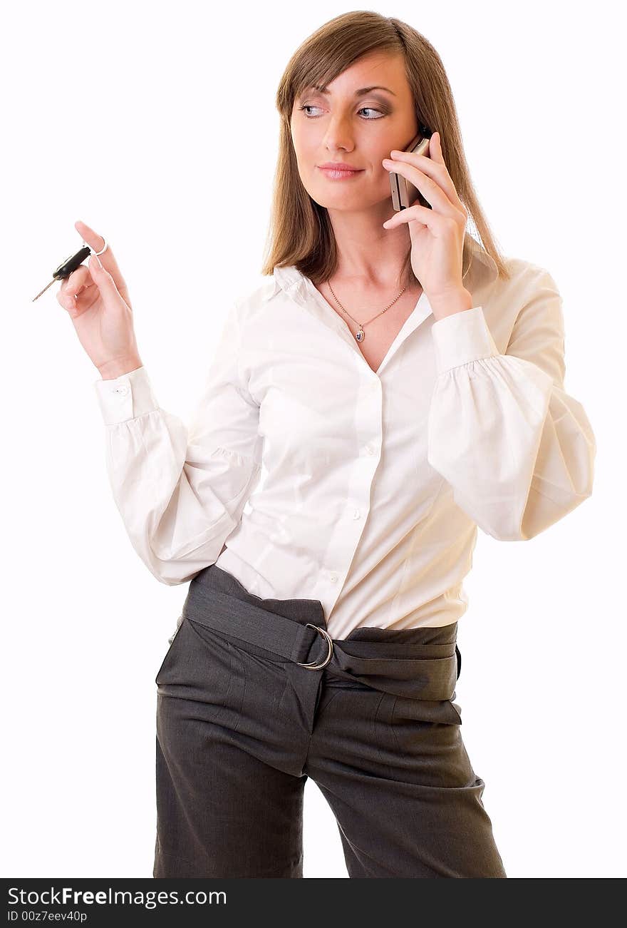 Businesswoman With Keys And Mobile Phone