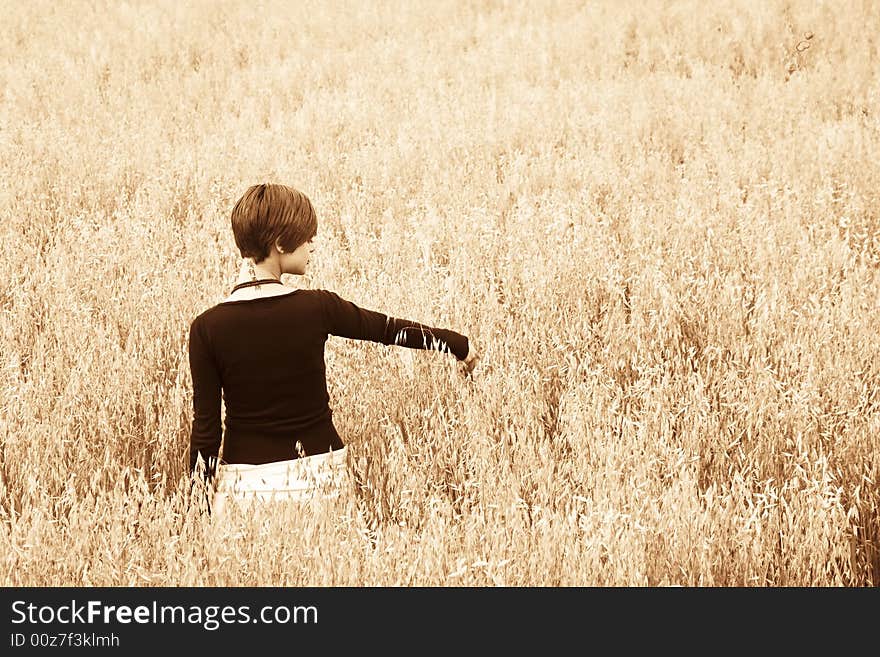 Woman on field, soft gilt toned.