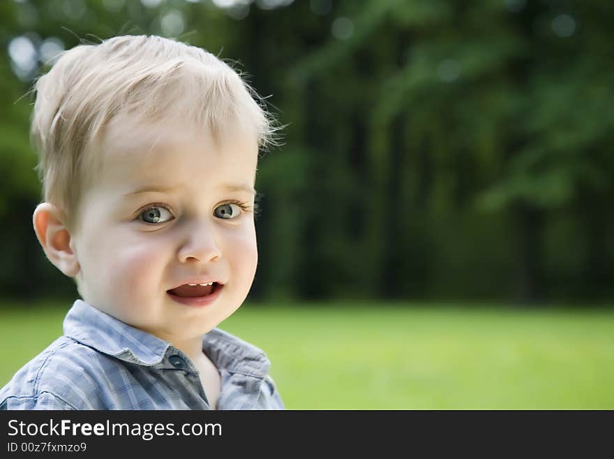 Little Kid Portrait On Natural Background. Little Kid Portrait On Natural Background