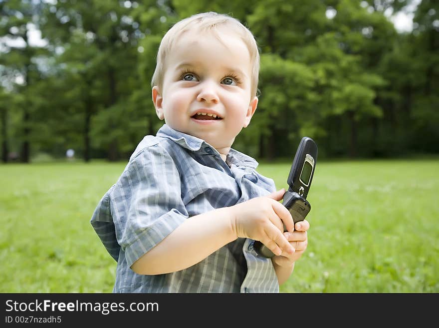 The Surprised Kid With Phone In His Hands