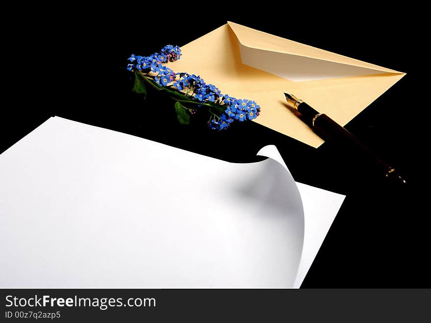 Envelope with flowers and pen