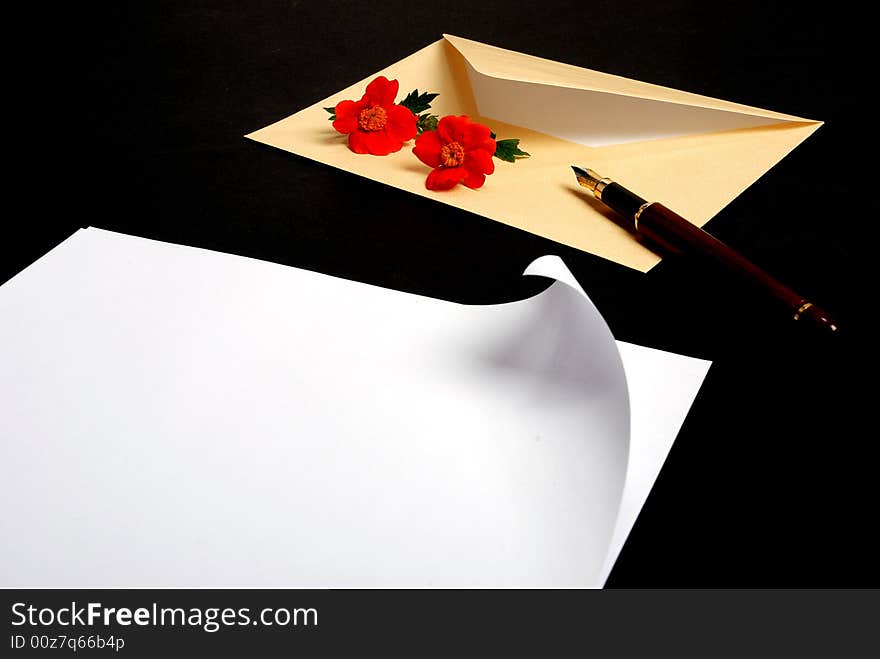 Envelope with flowers and pen