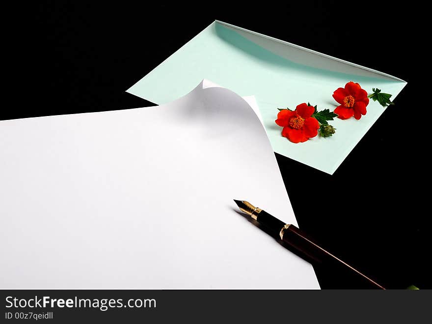 Envelope with flowers and pen