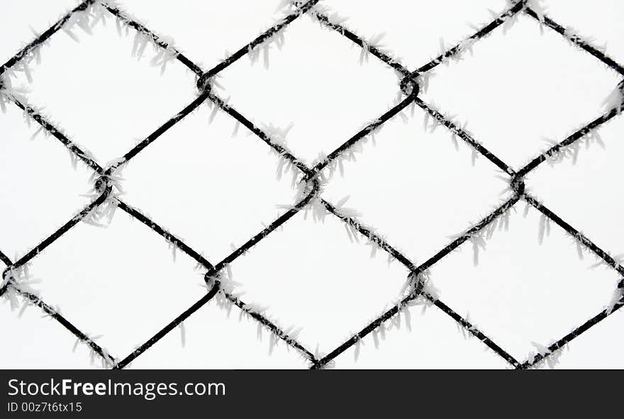 Wire fence during cold winter with frost. Wire fence during cold winter with frost