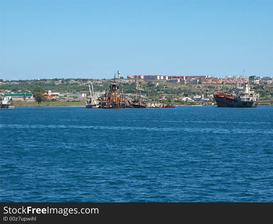 This is a photo of some wrecks in the port of August (Sicily)