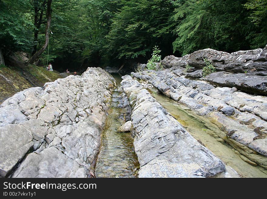 Mountain river in encirclement granite declivity