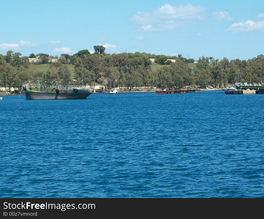 This is a photo of some wrecks in the port of August (Sicily)