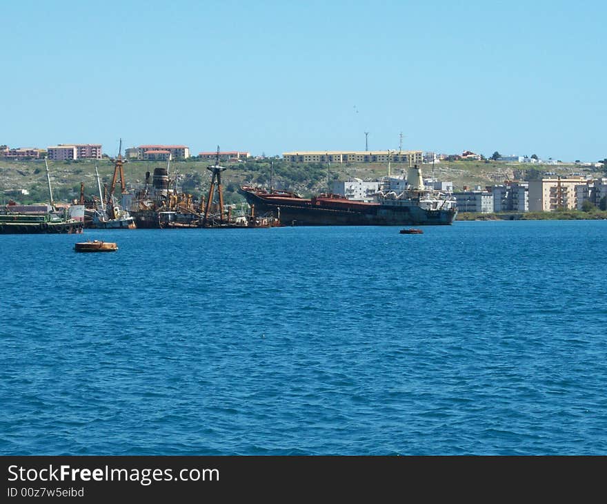 This is a photo of some wrecks in the port of August (Sicily)