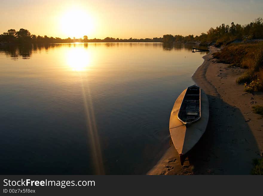 Sunset at riverside with boat