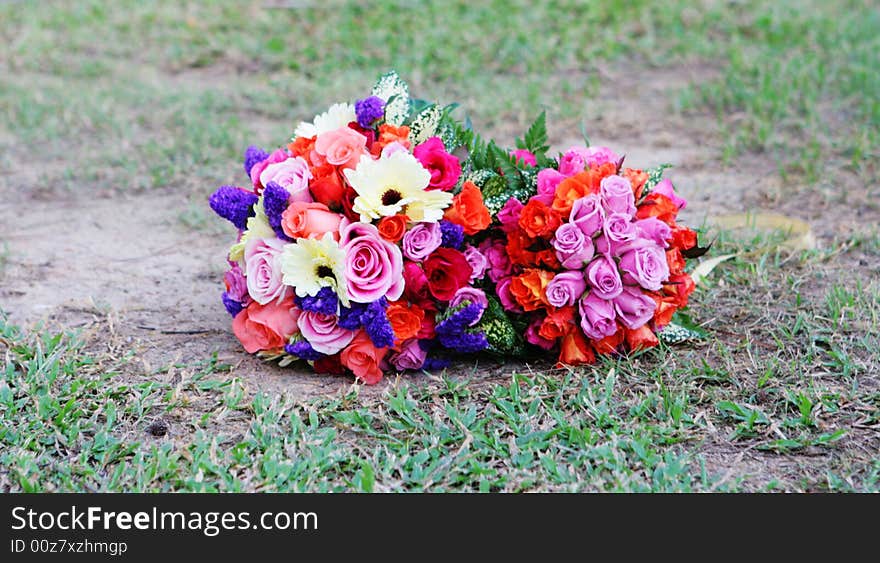 Colorful wedding bouquet on the grass.