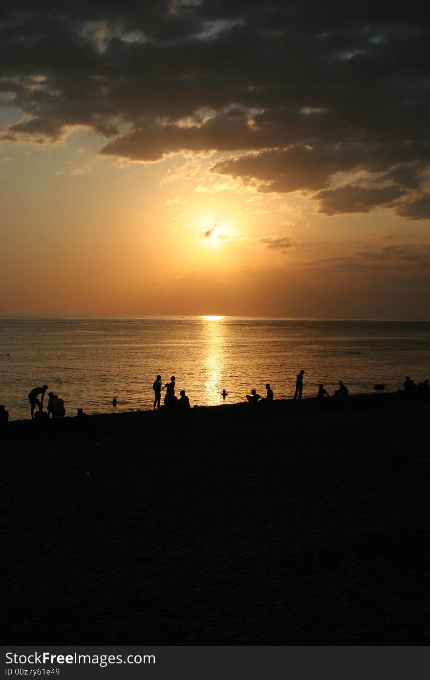 Stony sea beach on background sky