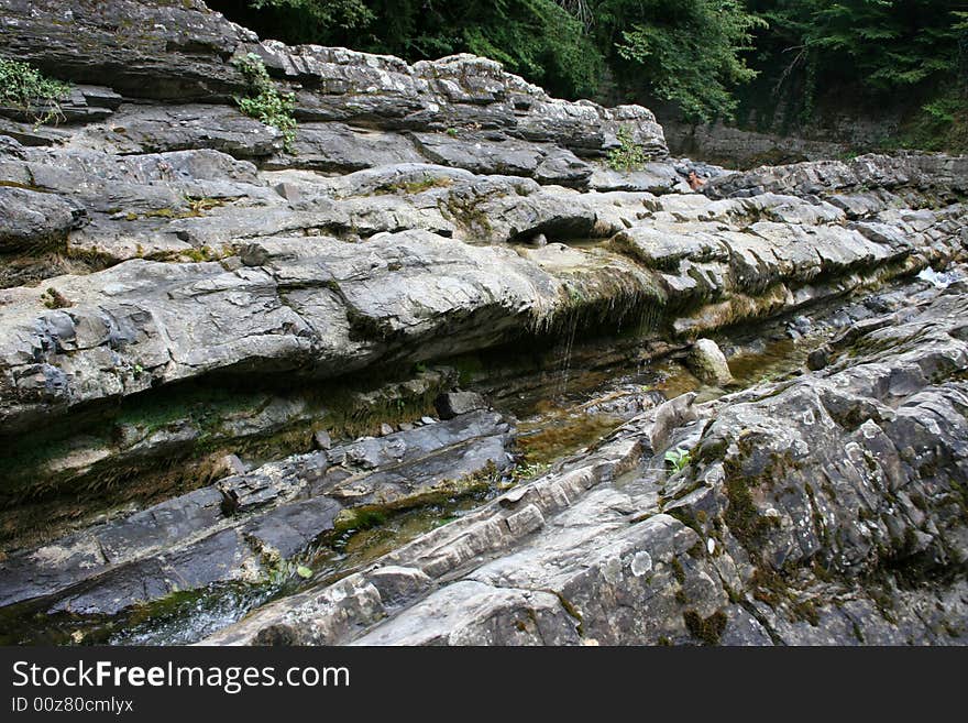 Mountain river in encirclement granite declivity