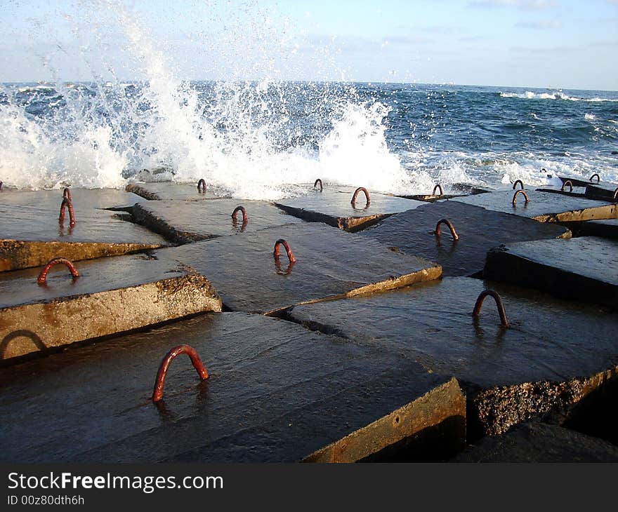 Splash water with stones in sea