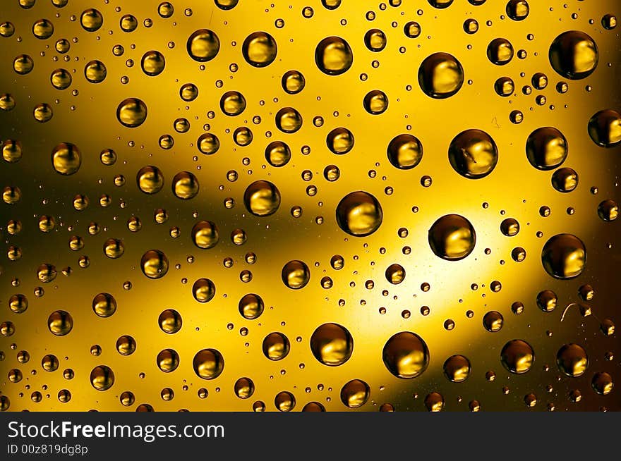 Yellow water drops spots background