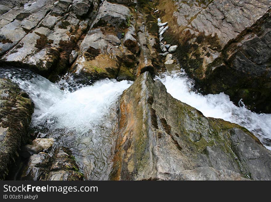 Mountain river in encirclement granite declivity