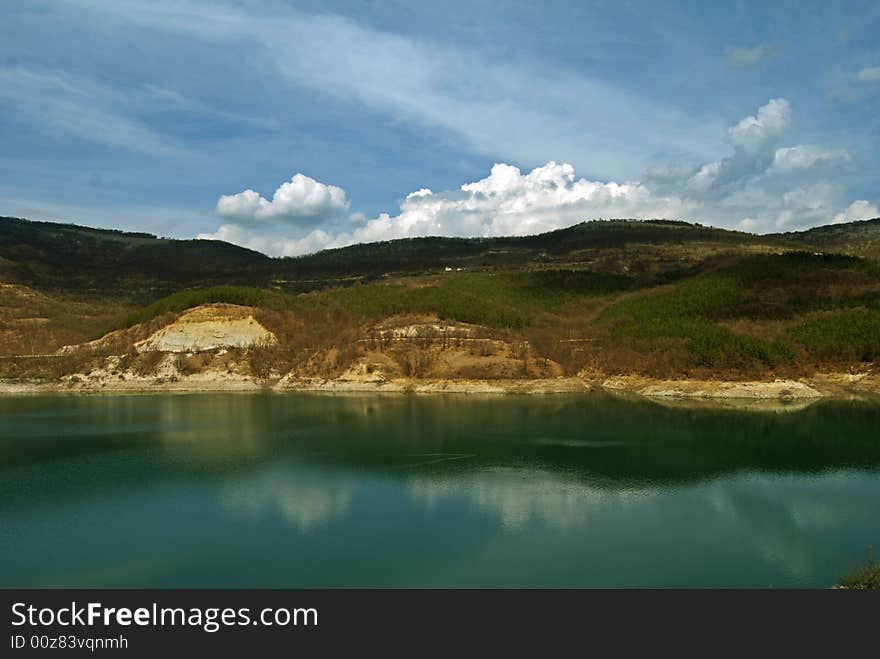 Lake with blue sky with clouds in sunny day. Lake with blue sky with clouds in sunny day