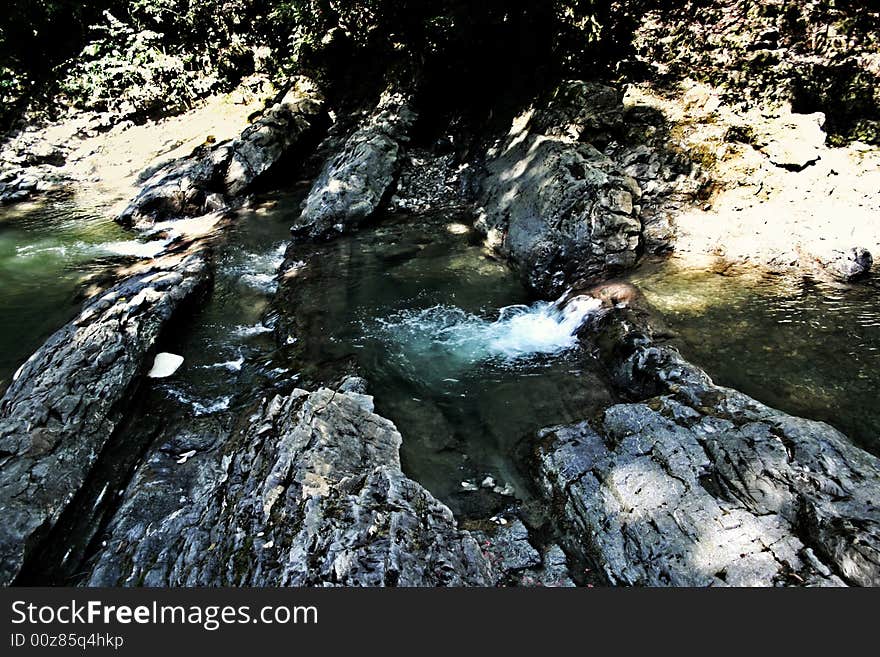 Mountain river in encirclement granite declivity